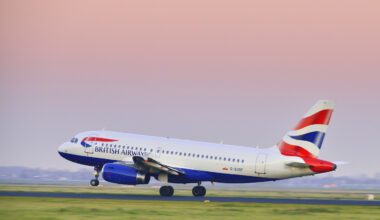 Schiphol, The Netherlands - November 14, 2012: British Airways Airbus A319 taking off from Schiphol airport in a sunset at the end of the day.
